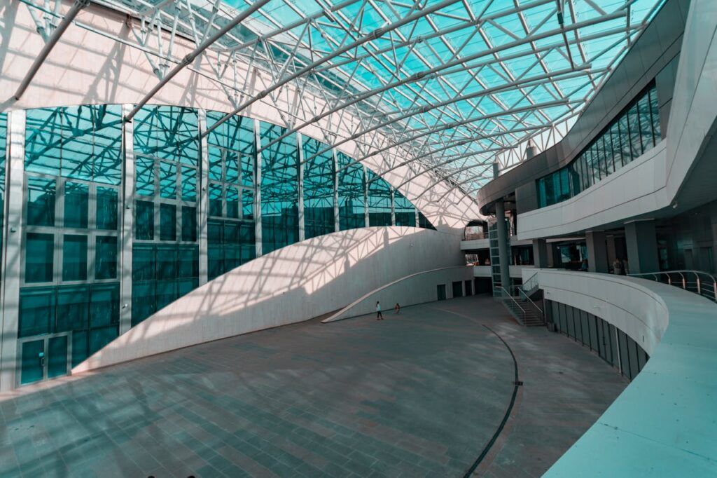 pexels photo 1022189 Spacious indoor atrium with modern glass and steel architecture, showcasing a futuristic design.