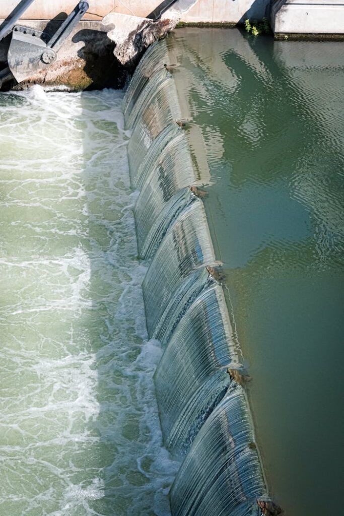 pexels photo 17761547 An urban watergate controlling river flow, showing dynamic water movement and engineering design.